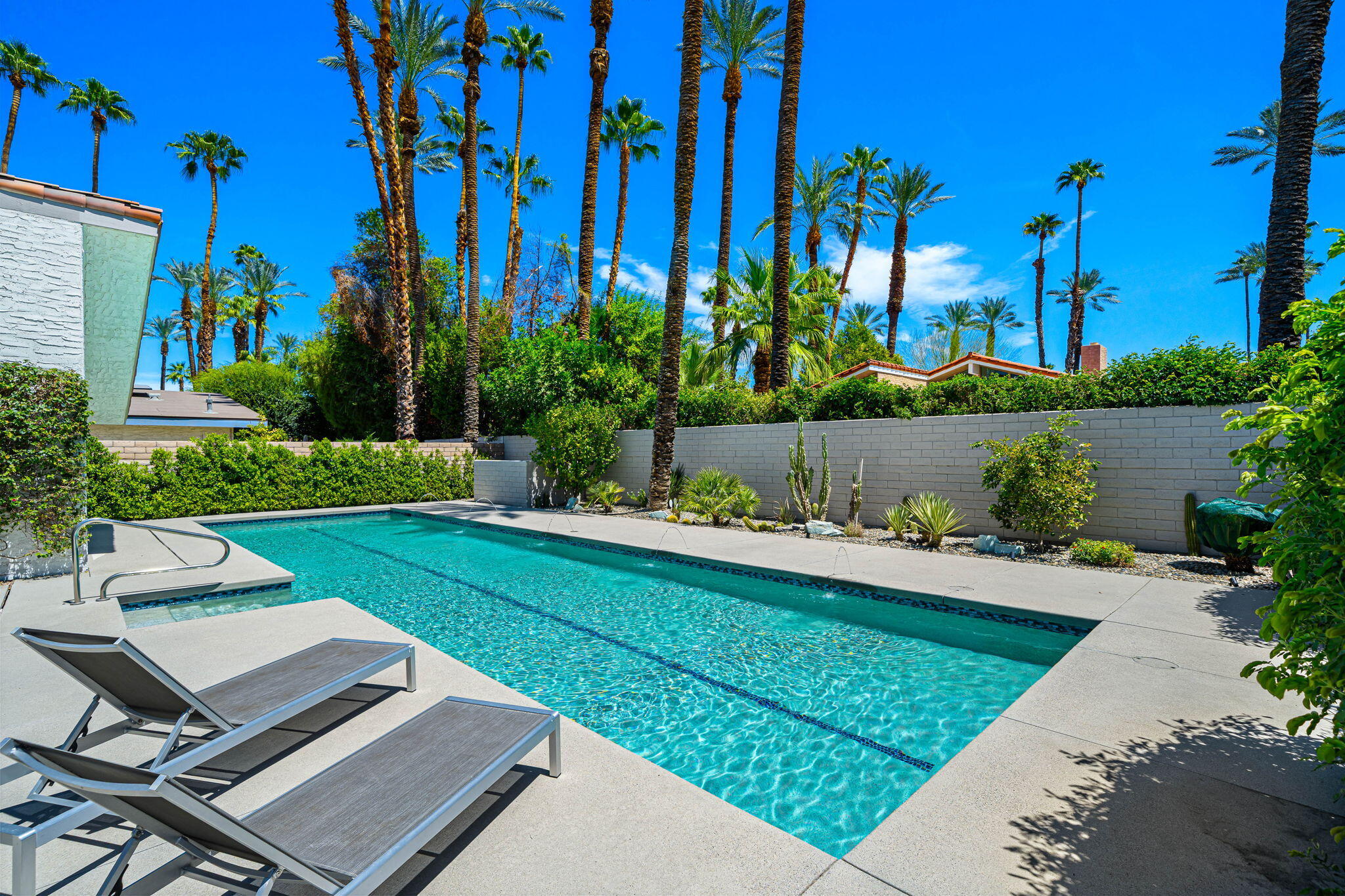 41 Lincoln Place Rancho Mirage, CA 92270 - Photo 32 of 37 a view of a backyard with plants and a patio