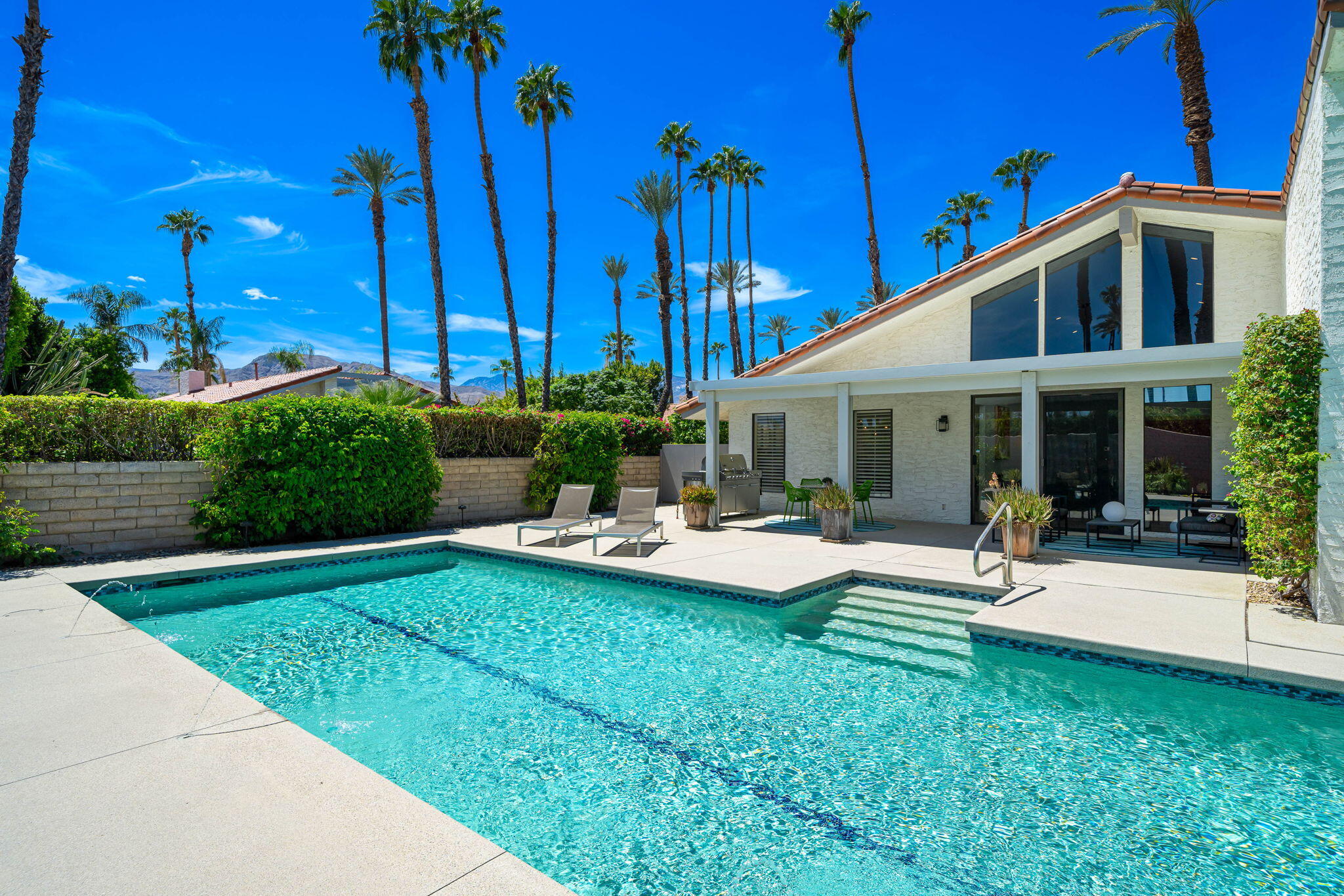 41 Lincoln Place Rancho Mirage, CA 92270 - Photo 35 of 37 a view of a house with backyard sitting area and swimming pool