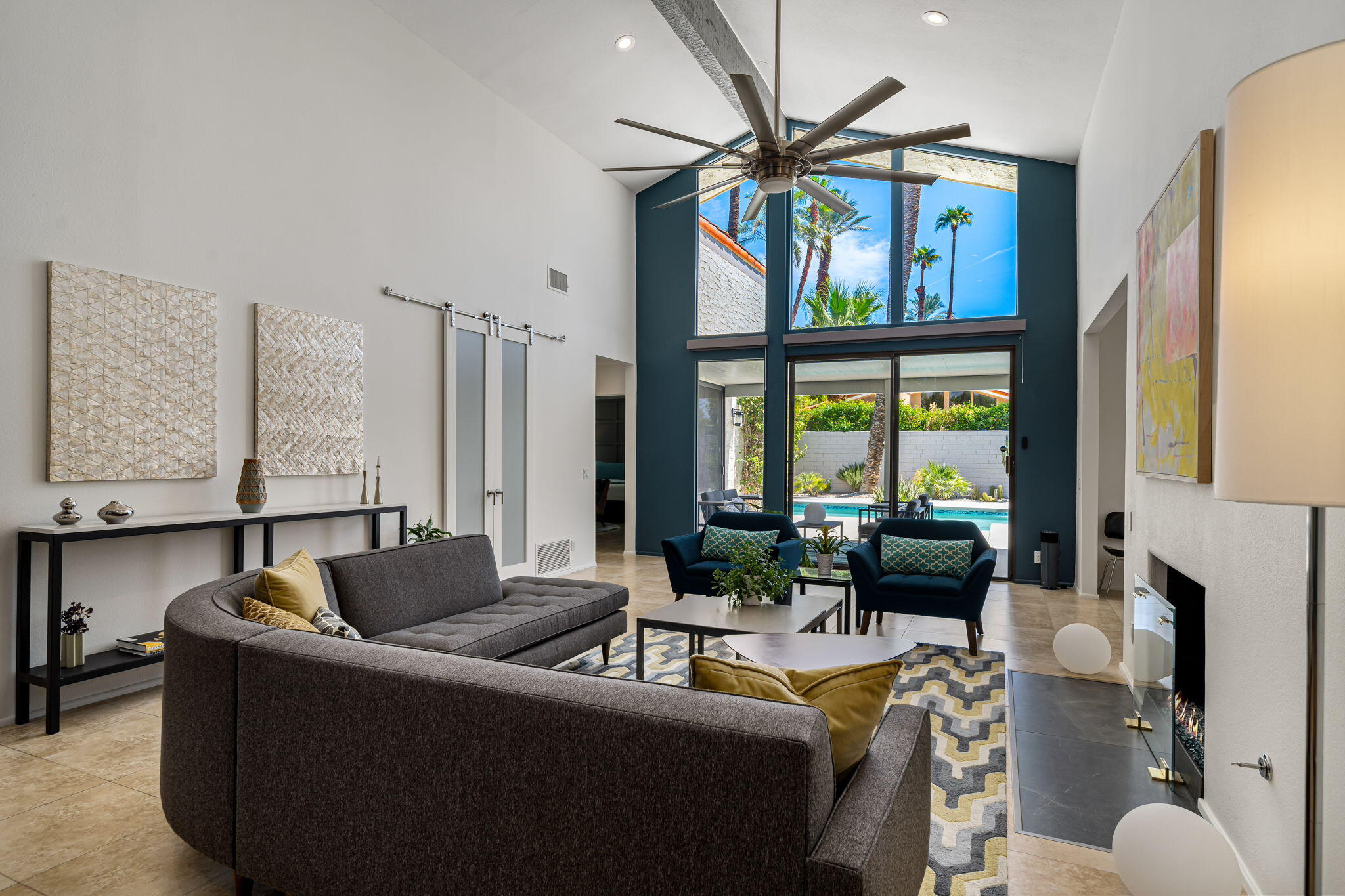 41 Lincoln Place Rancho Mirage, CA 92270 - Photo 6 of 37 a living room with furniture a fireplace and a large window