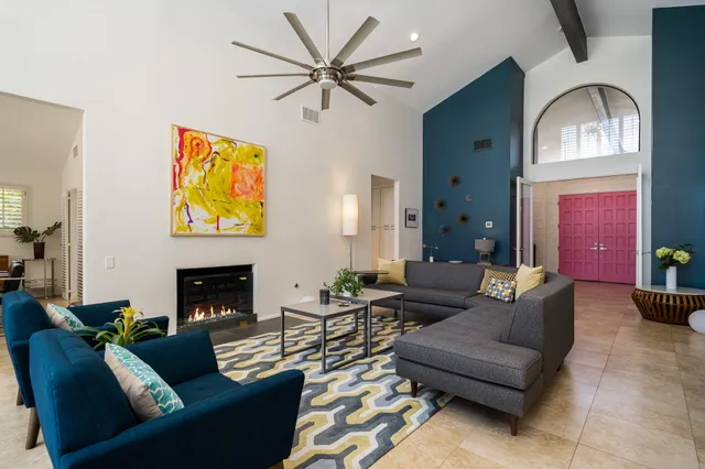 a living room with furniture and a fireplace