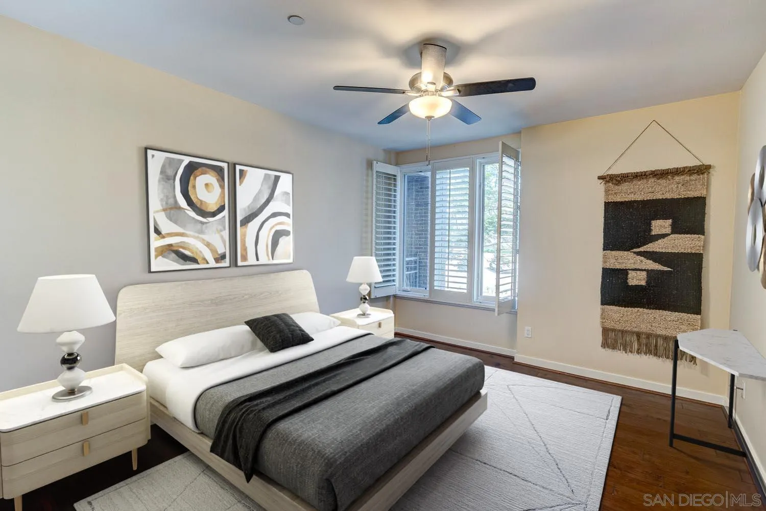 5440 La Jolla Boulevard, Unit E208 La Jolla, CA 92037 - Photo 13 of 35 a bedroom with a bed and a chandelier