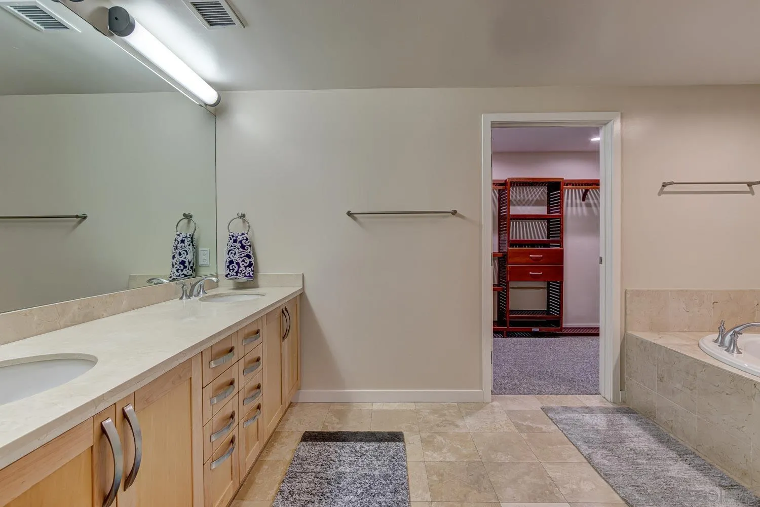 5440 La Jolla Boulevard, Unit E208 La Jolla, CA 92037 - Photo 14 of 35 a room with a baby crib and a sink