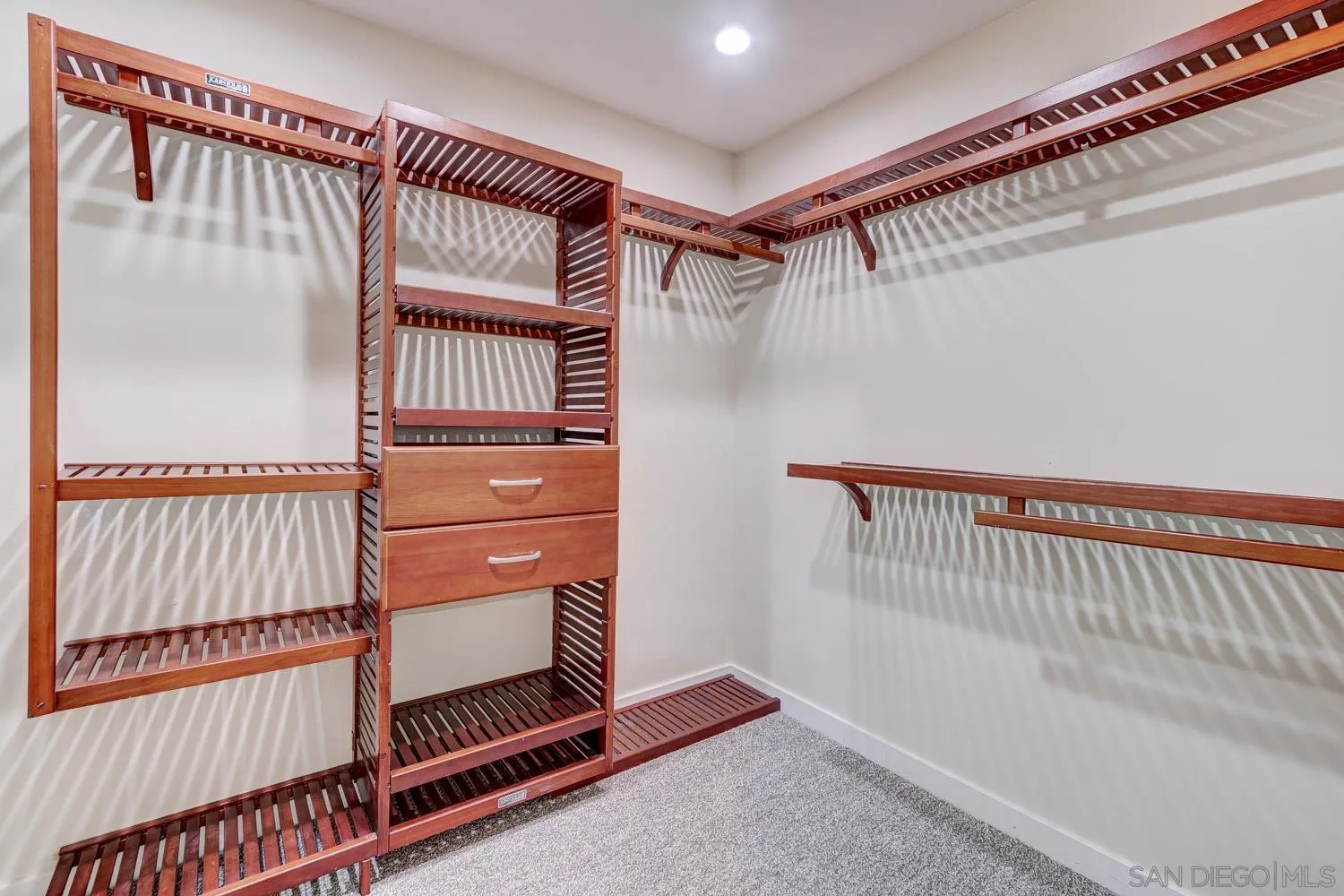 5440 La Jolla Boulevard, Unit E208 La Jolla, CA 92037 - Photo 17 of 35 a view of an empty room with wooden floor