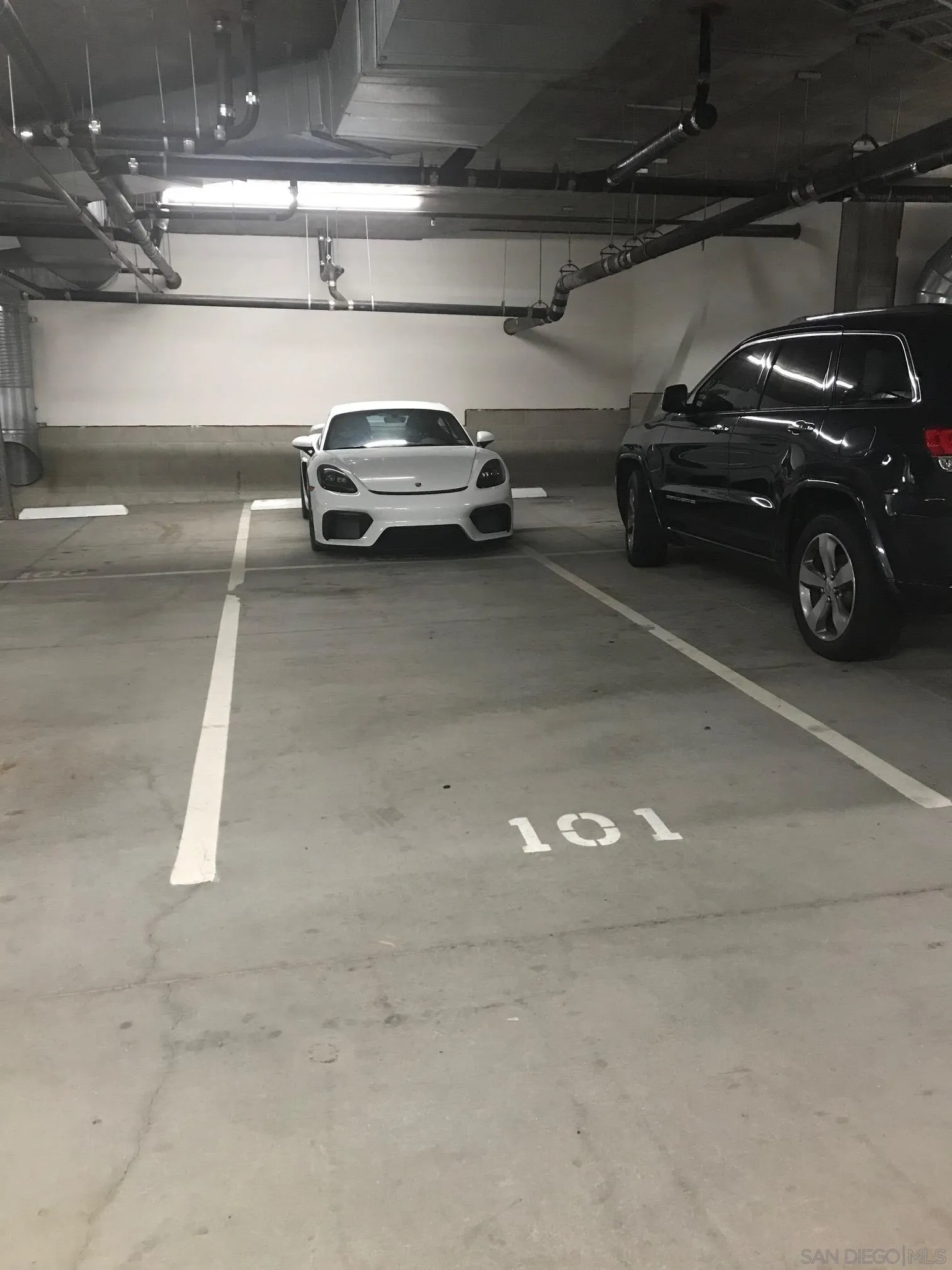 5440 La Jolla Boulevard, Unit E208 La Jolla, CA 92037 - Photo 33 of 35 a view of parking garage with cars