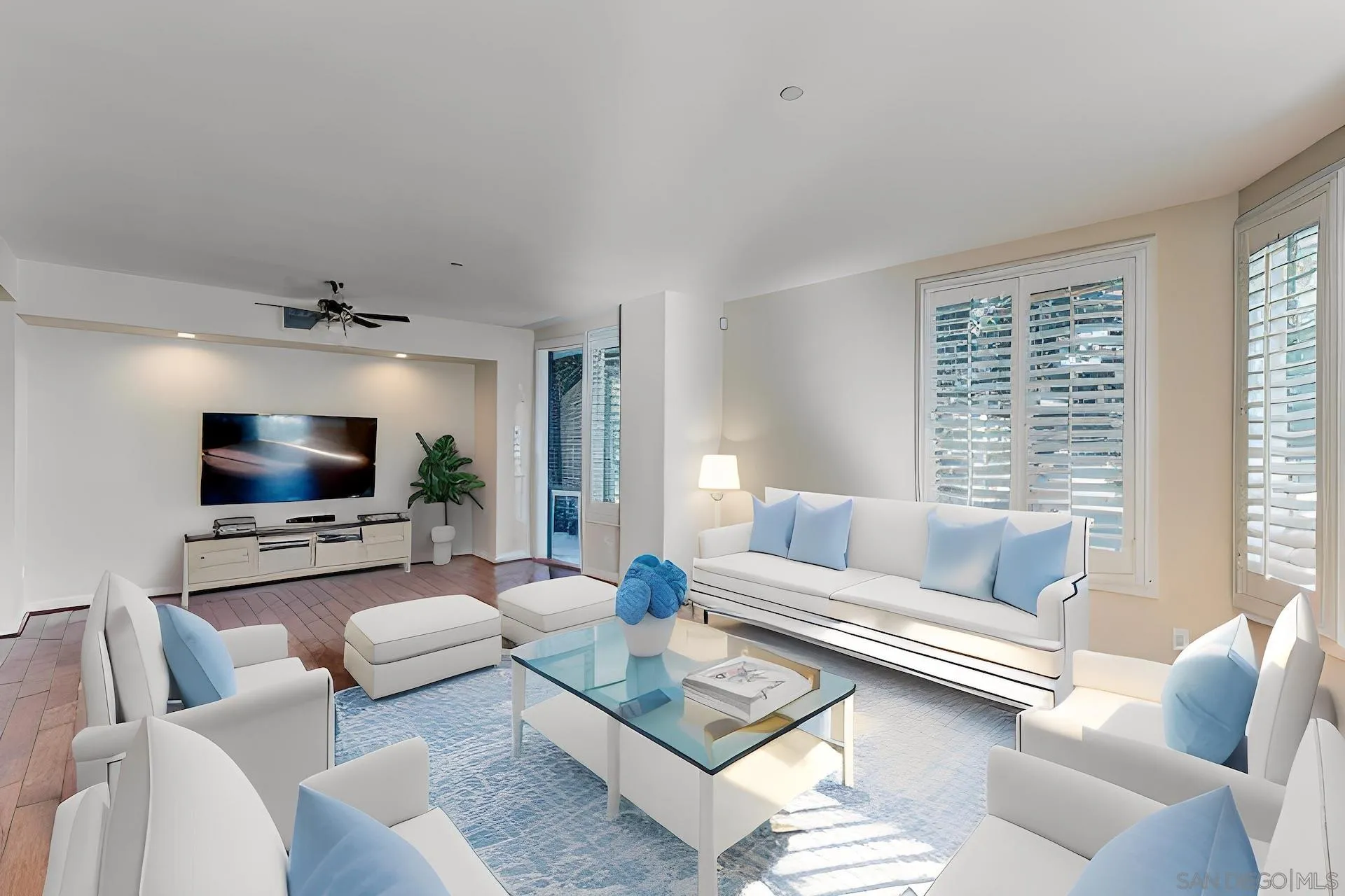 5440 La Jolla Boulevard, Unit E208 La Jolla, CA 92037 - Photo 8 of 35 a living room with furniture and a flat screen tv