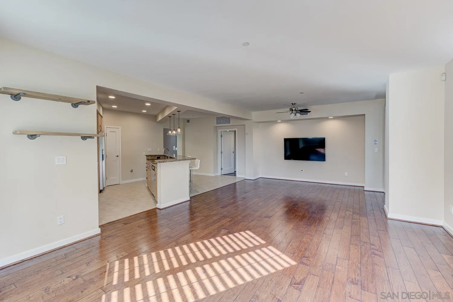 5440 La Jolla Boulevard, Unit E208 La Jolla, CA 92037 - Photo 10 of 35 a view of a livingroom with wooden floor