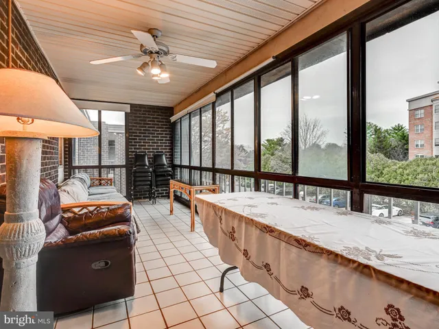 a large room with kitchen island granite countertop a large window