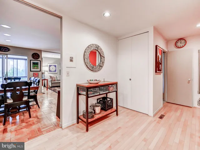 a view of a room with furniture and wooden floor