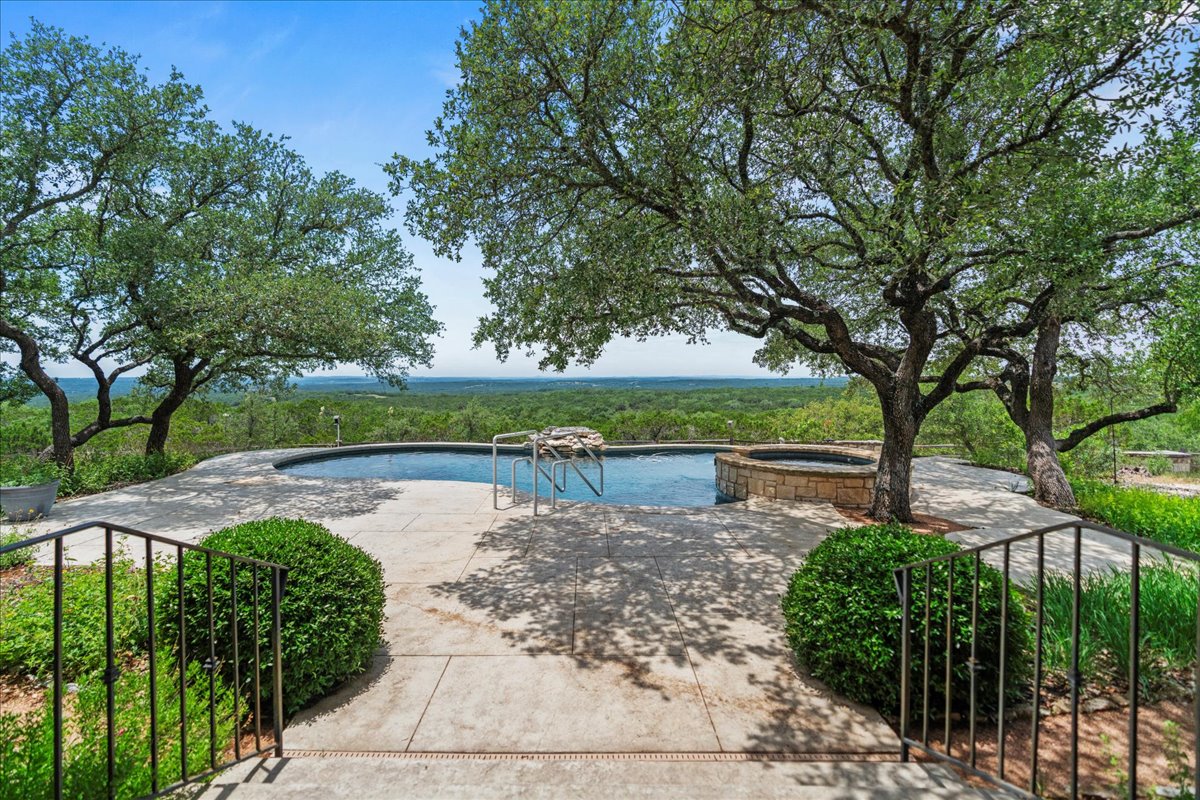 167 Wimberley Ranch Drive Wimberley, TX 78676 - Photo 8 of 40 a view of a lake with large trees
