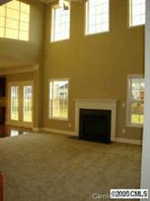 1006 Loudoun Road, Unit AD147 Indian Trail, NC 28079 - Photo 1 of 3 a view of an empty room with a fireplace and a window