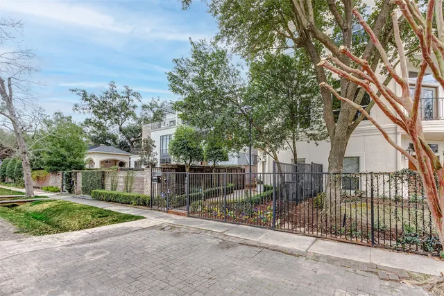 a view of a house with a iron gate