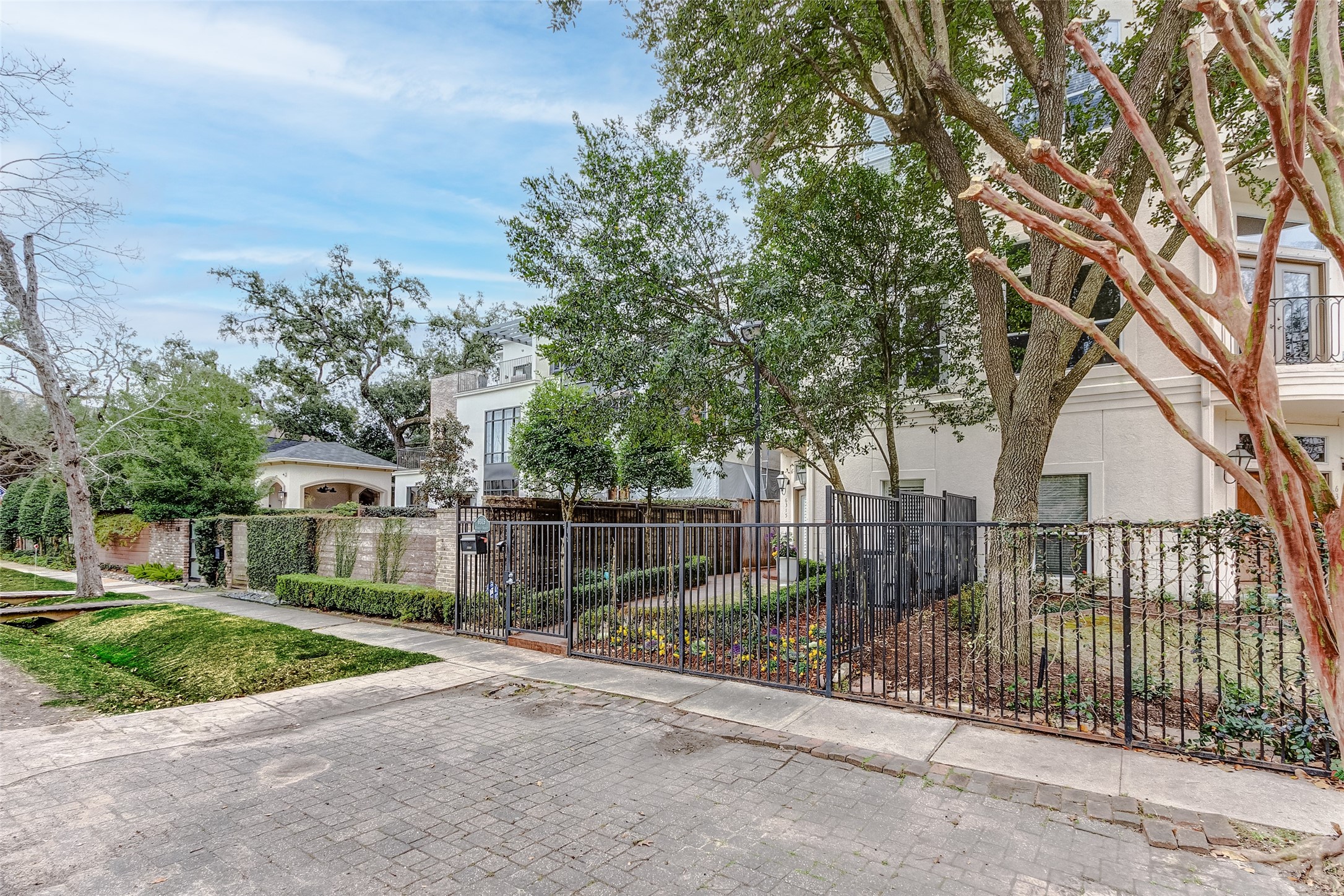a view of a house with a iron gate