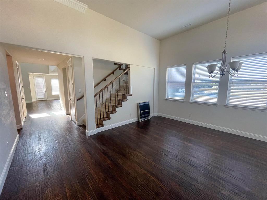 723 Callaway Drive Allen, TX 75013 - Photo 2 of 25 a view of an empty room with wooden floor and a window