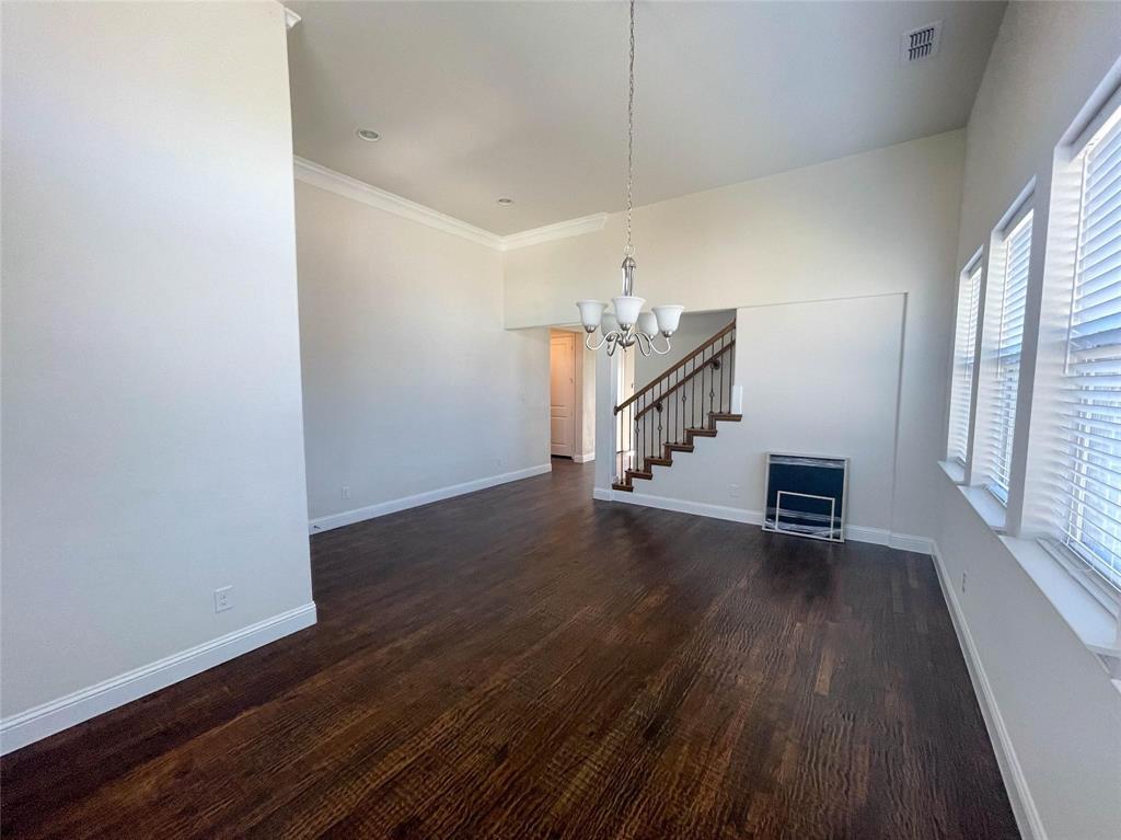 723 Callaway Drive Allen, TX 75013 - Photo 3 of 25 an empty room with wooden floor and windows