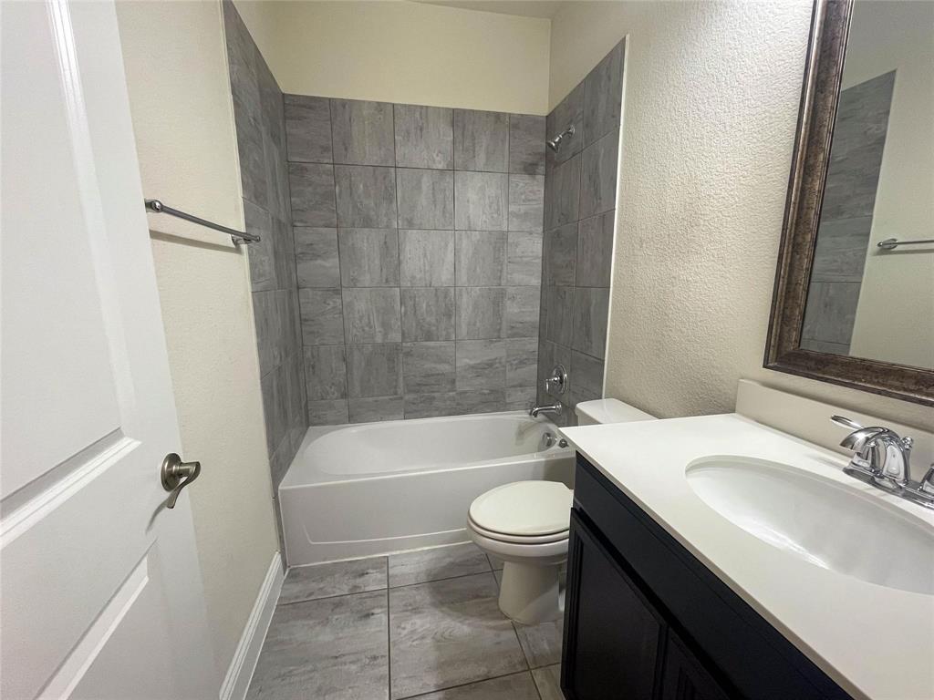 723 Callaway Drive Allen, TX 75013 - Photo 6 of 25 a bathroom with a sink a toilet a bathtub and shower