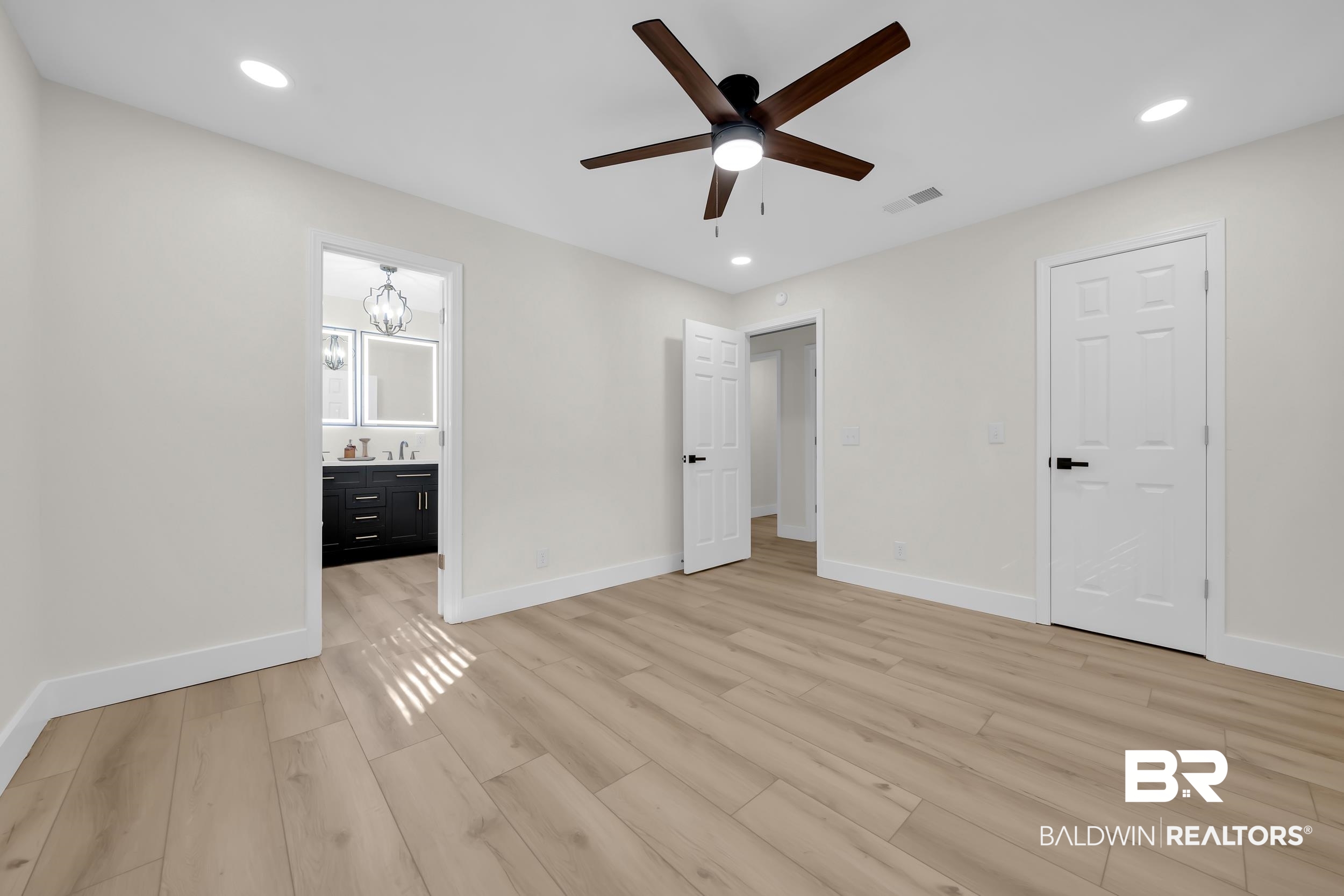 8170 Wilmer Georgetown Road Wilmer, AL 36587 - Photo 12 of 31 Spacious room featuring wood-finish flooring, recessed lighting, and a ceiling fan with integrated light