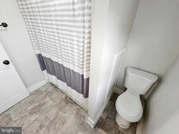 a bathroom with a toilet and a sink