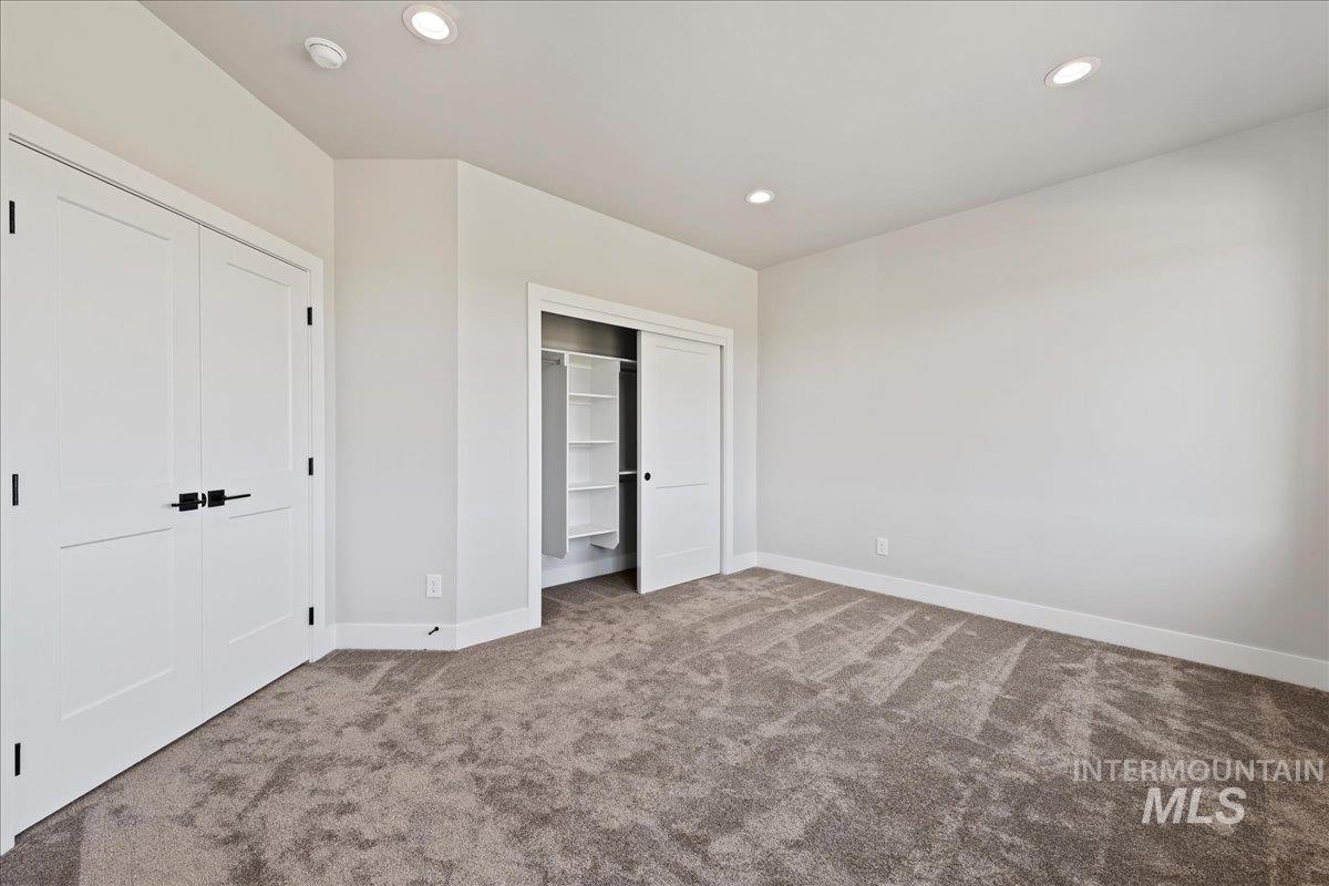 985 West Malbar Street Meridian, ID 83646 - Photo 27 of 39 Carpeted interior space featuring white walls and a white ceiling with recessed lighting