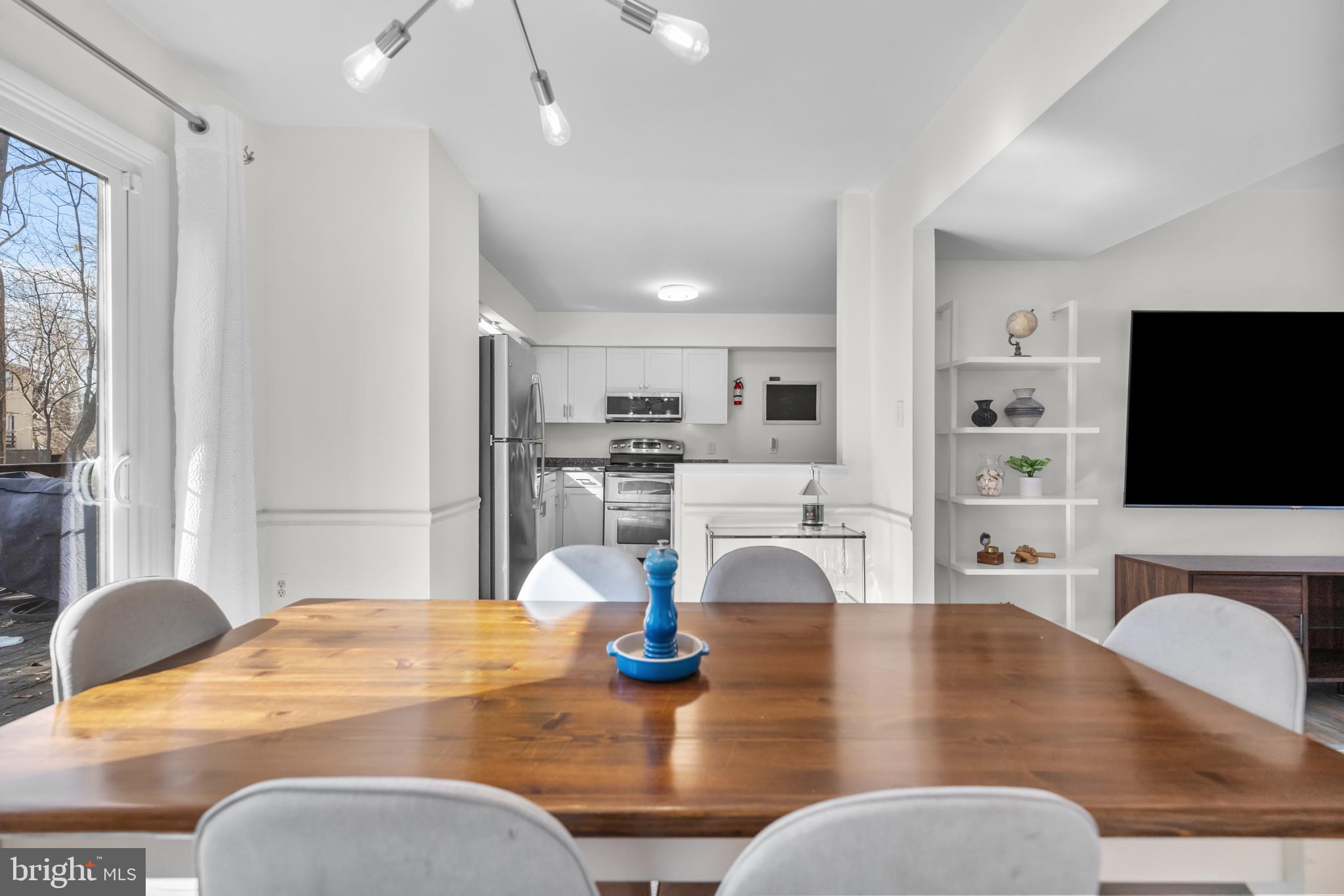 2320 Emerald Heights Court Reston, VA 20191 - Photo 11 of 44 a kitchen with dining table and chairs