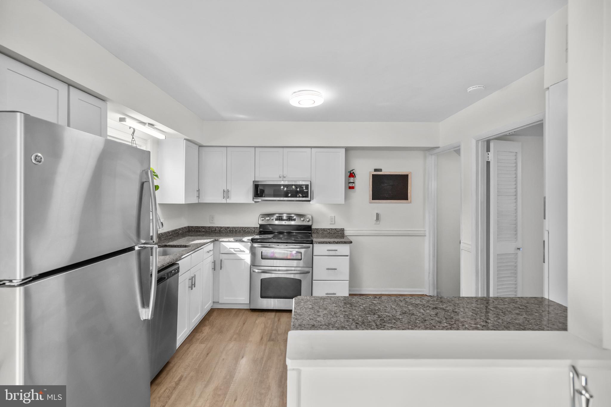 2320 Emerald Heights Court Reston, VA 20191 - Photo 16 of 44 a kitchen with stainless steel appliances granite countertop a refrigerator sink stove and oven