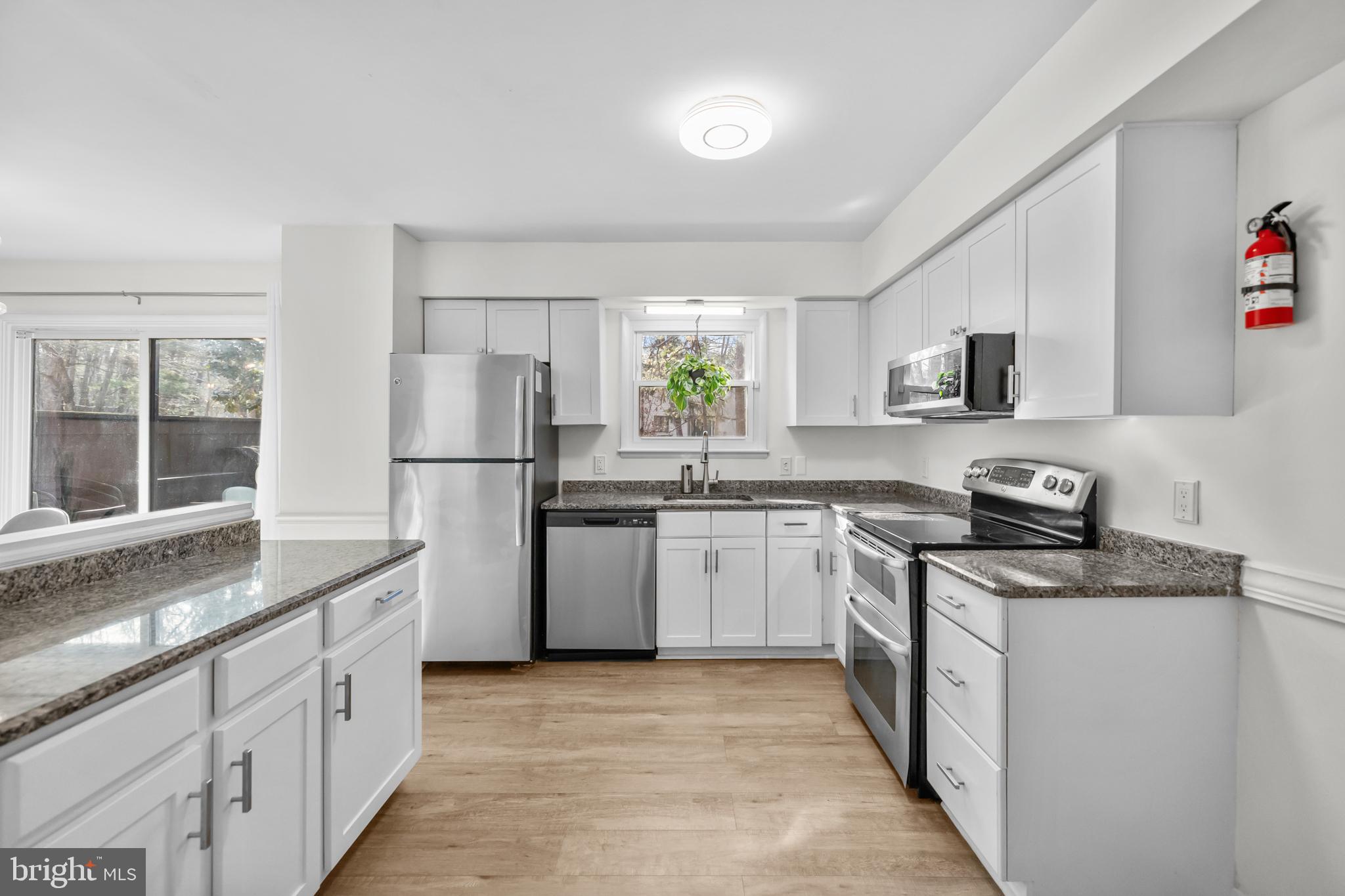 2320 Emerald Heights Court Reston, VA 20191 - Photo 18 of 44 a kitchen with a sink stove and refrigerator