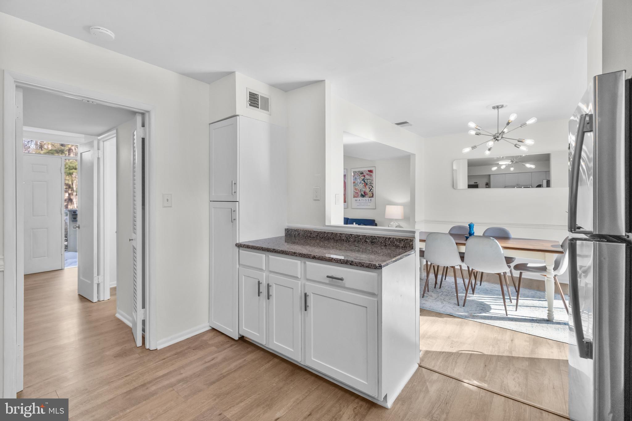 2320 Emerald Heights Court Reston, VA 20191 - Photo 20 of 44 a spacious bathroom with a granite countertop sink a mirror and a shower