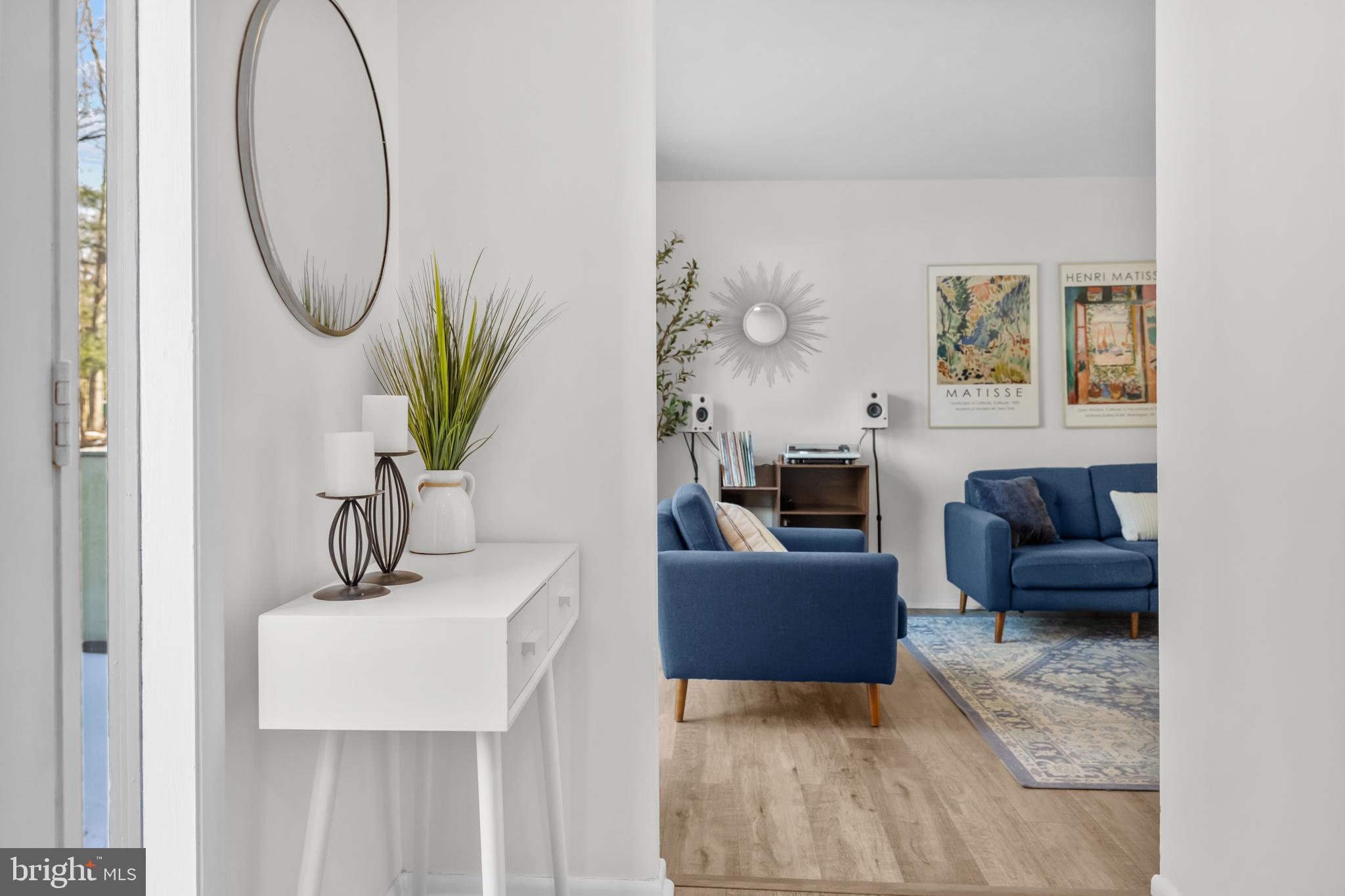 2320 Emerald Heights Court Reston, VA 20191 - Photo 22 of 44 a living room with furniture a table and a potted plant