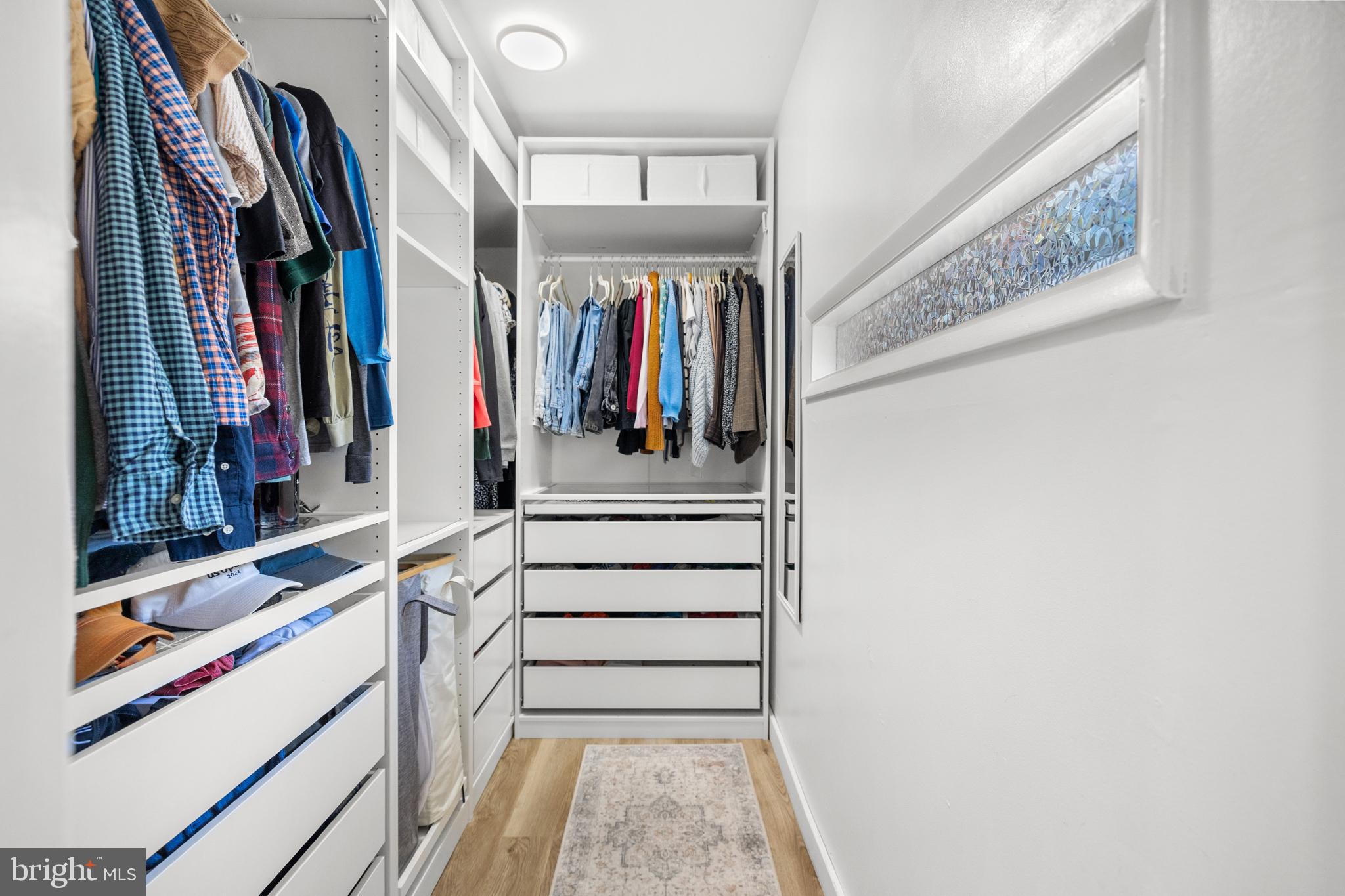 2320 Emerald Heights Court Reston, VA 20191 - Photo 25 of 44 a view of walk in closet with clothes and shoes
