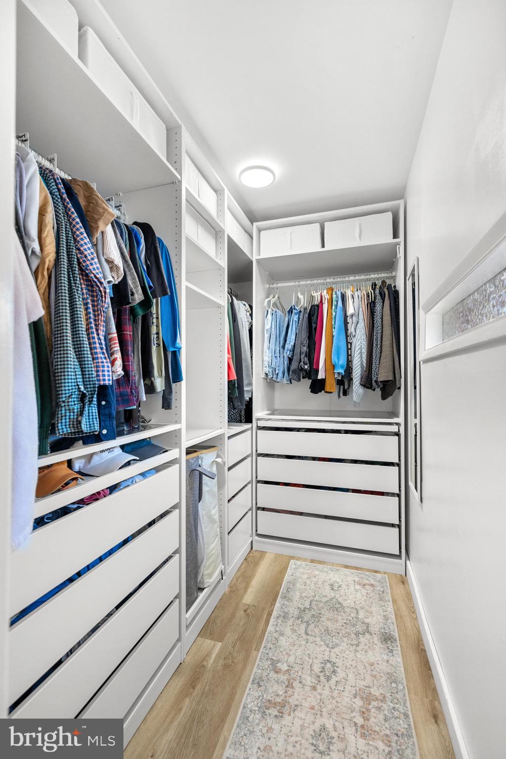 2320 Emerald Heights Court Reston, VA 20191 - Photo 26 of 44 a view of walk in closet with clothes and shoes