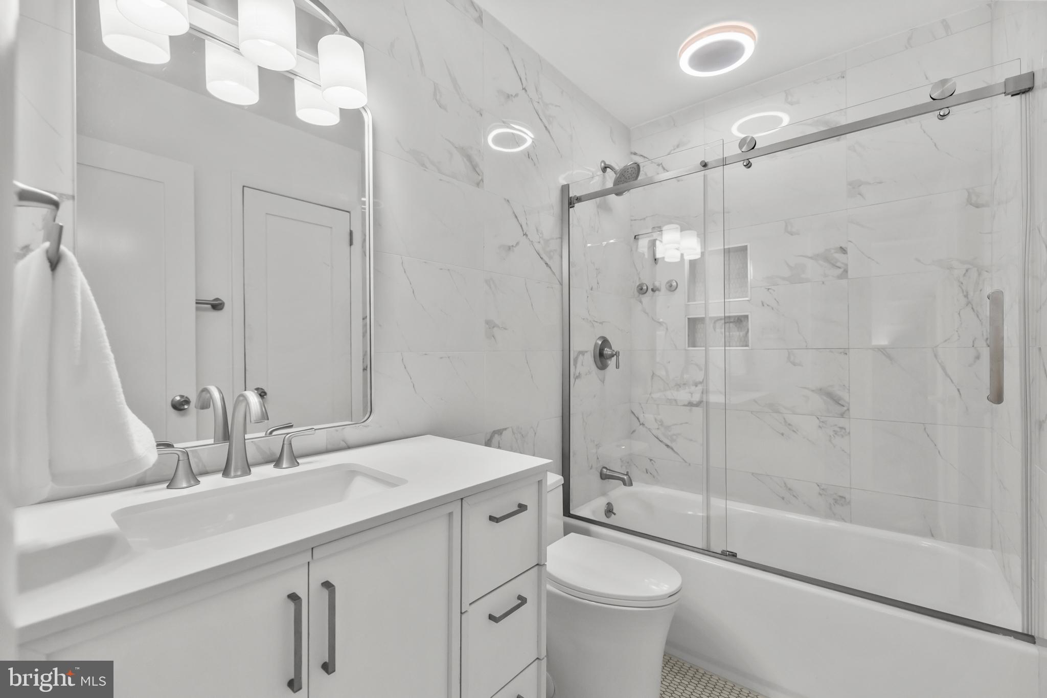 2320 Emerald Heights Court Reston, VA 20191 - Photo 27 of 44 a bathroom with a sink a toilet and shower