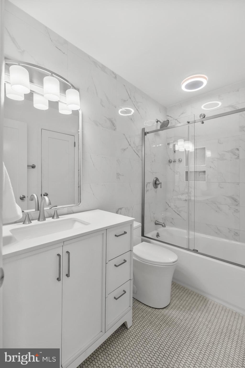 2320 Emerald Heights Court Reston, VA 20191 - Photo 28 of 44 a bathroom with a double vanity sink mirror and toilet