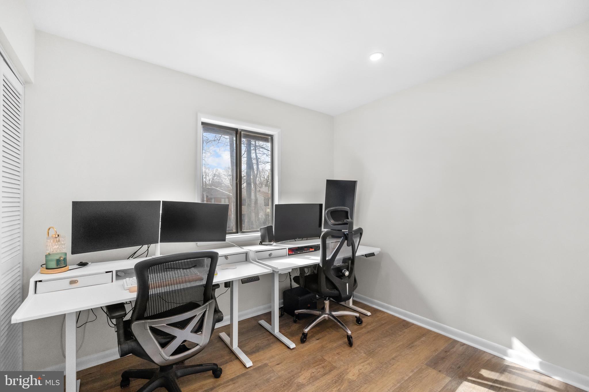 2320 Emerald Heights Court Reston, VA 20191 - Photo 29 of 44 a view of a workspace with furniture and a flat screen tv