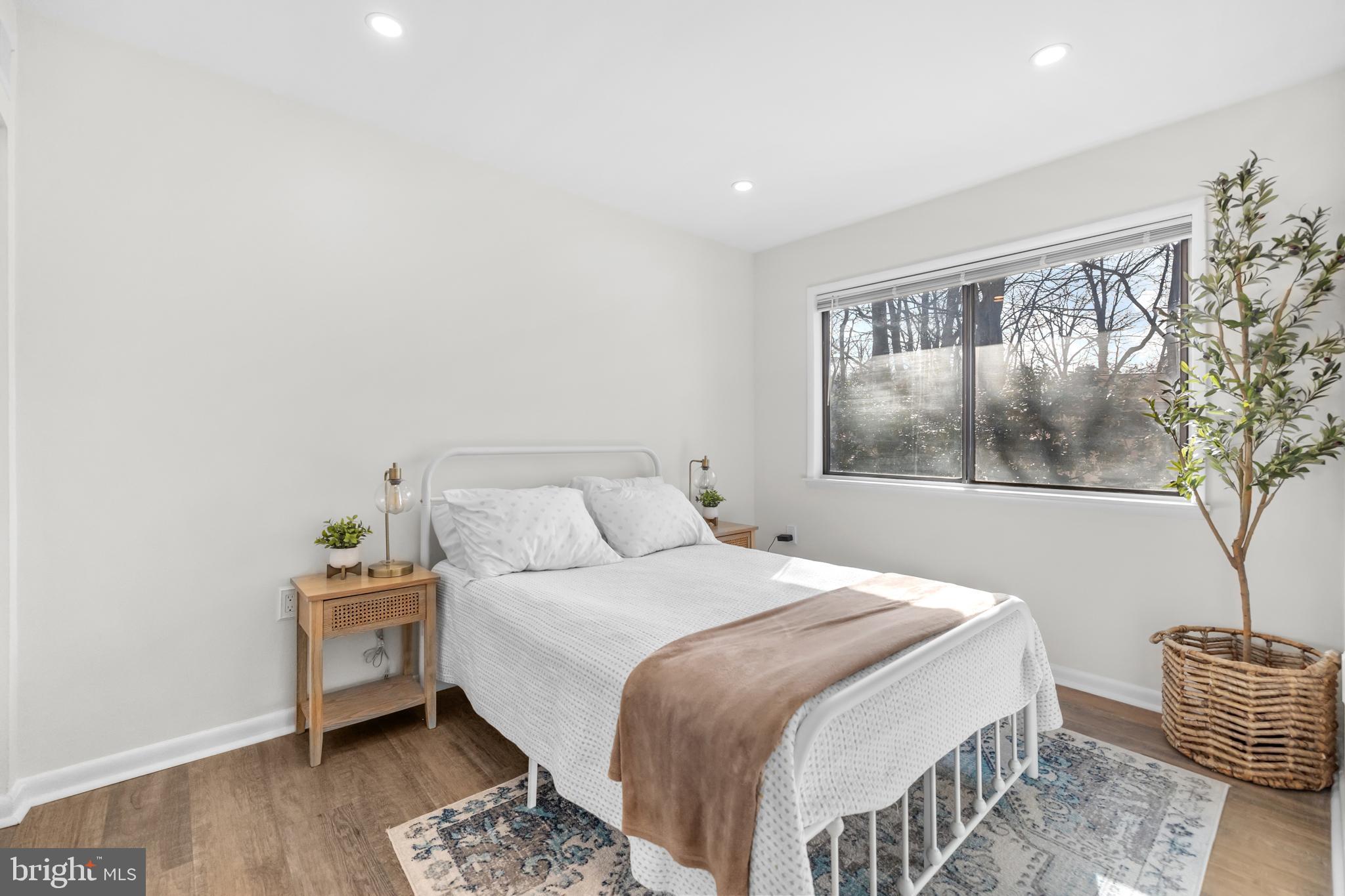 2320 Emerald Heights Court Reston, VA 20191 - Photo 31 of 44 a bedroom with a bed and wooden floor