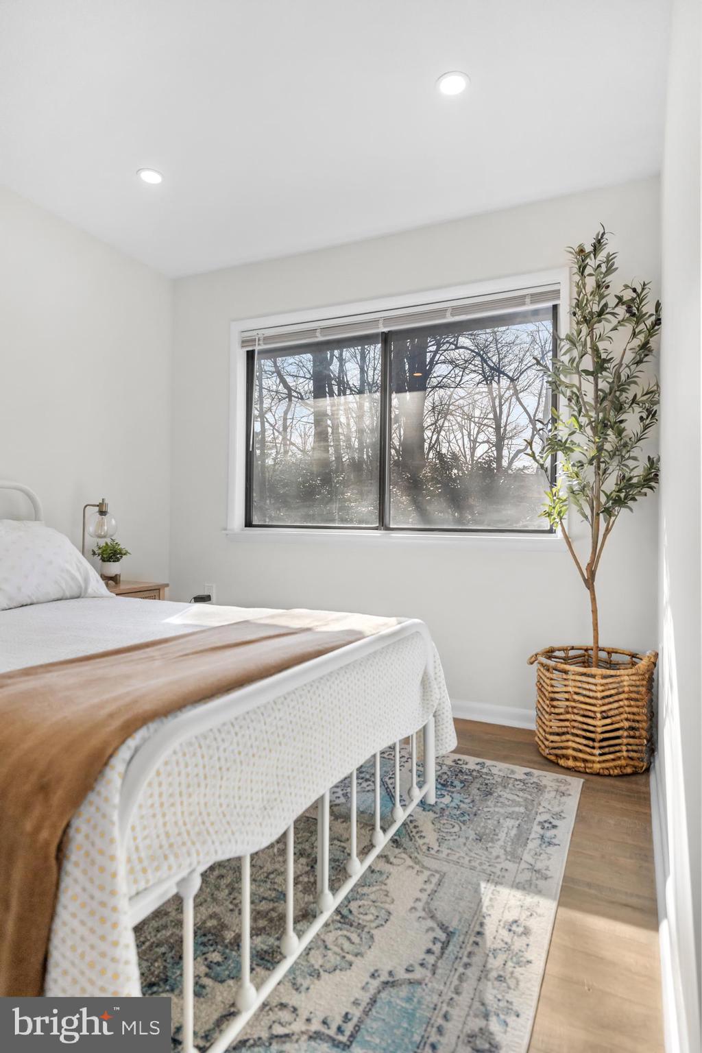 2320 Emerald Heights Court Reston, VA 20191 - Photo 32 of 44 a bedroom with a large bed and a window