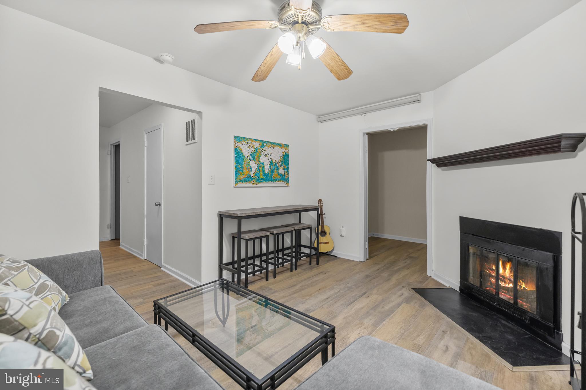 2320 Emerald Heights Court Reston, VA 20191 - Photo 34 of 44 a living room with furniture and a fireplace