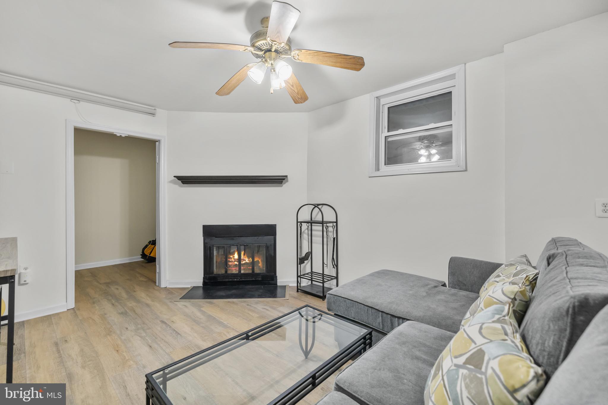 2320 Emerald Heights Court Reston, VA 20191 - Photo 36 of 44 a living room with furniture and a fireplace