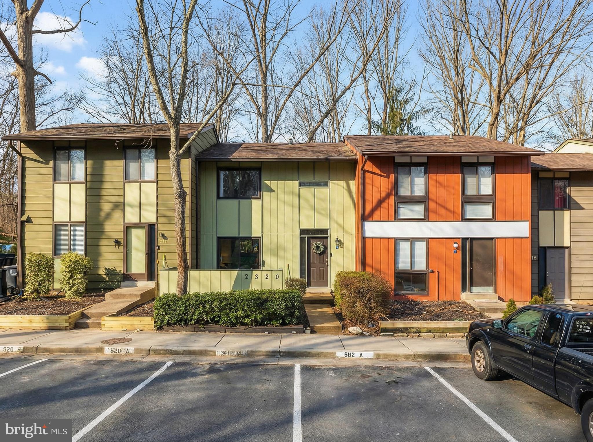 2320 Emerald Heights Court Reston, VA 20191 - Photo 39 of 44 a front view of a house with a yard and glass windows