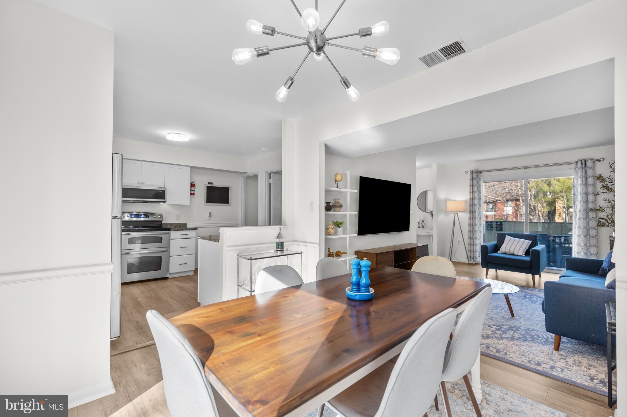 2320 Emerald Heights Court Reston, VA 20191 - Photo 4 of 44 a view of a dining room with furniture
