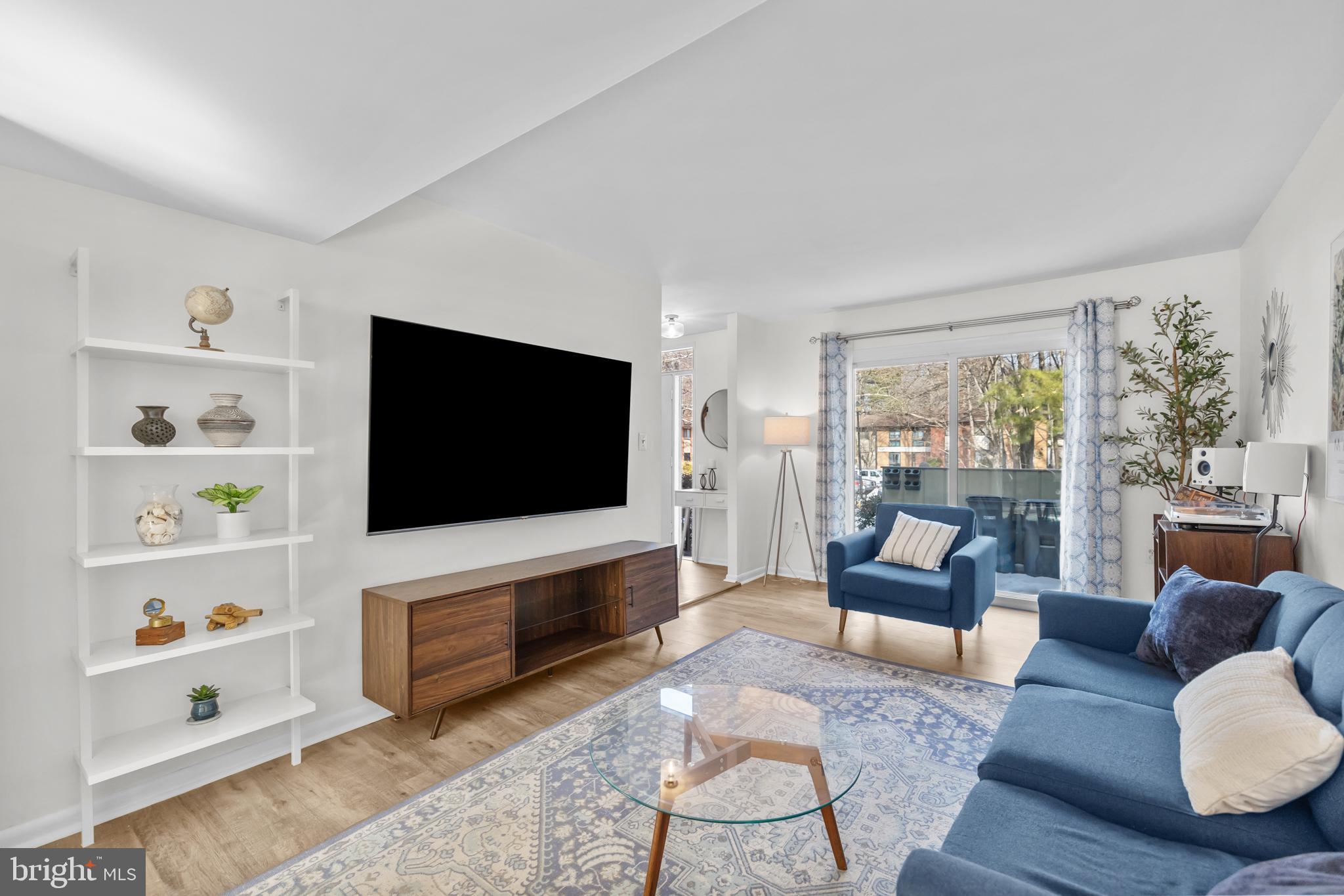 2320 Emerald Heights Court Reston, VA 20191 - Photo 8 of 44 a living room with furniture and a flat screen tv
