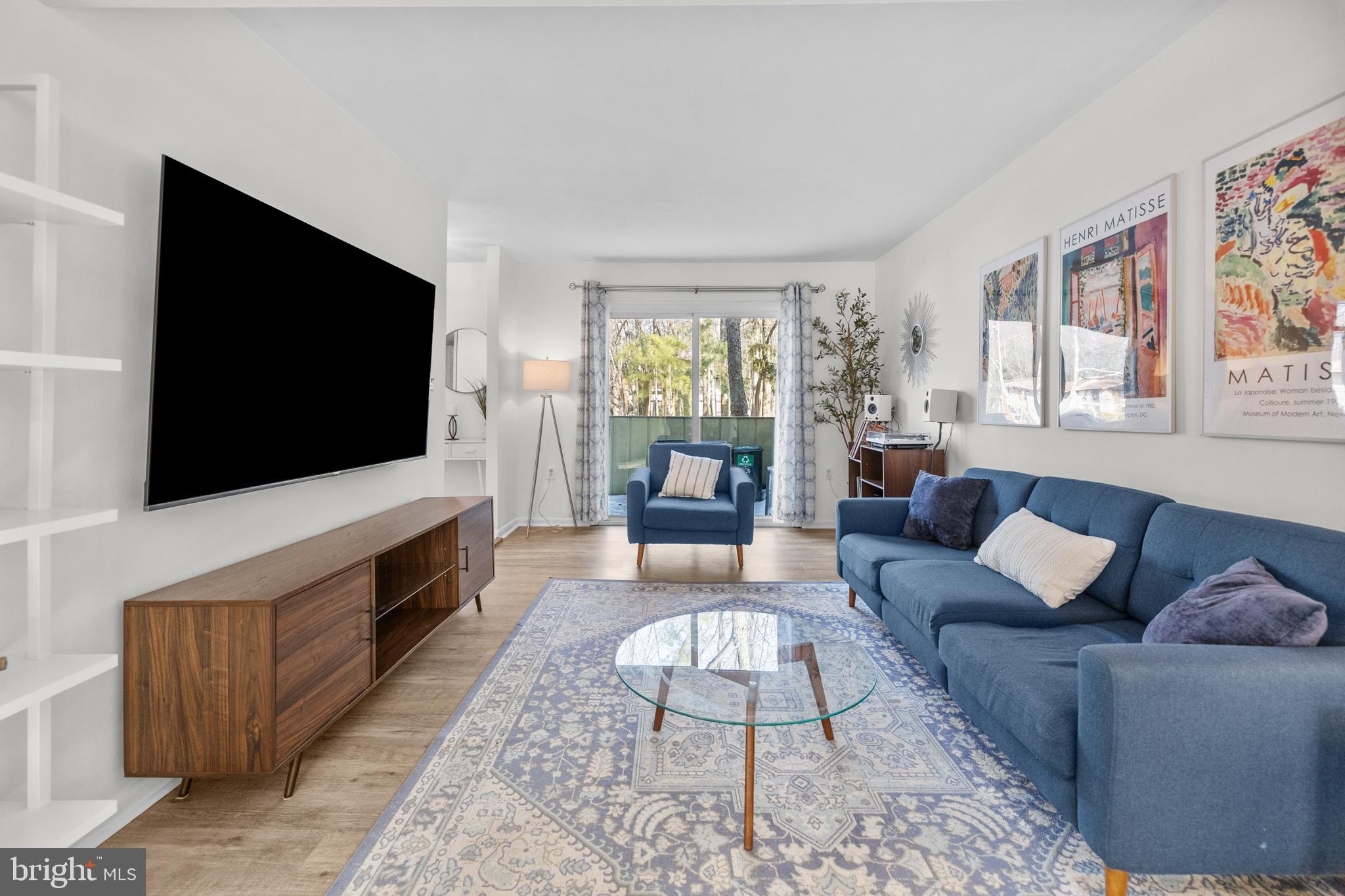 2320 Emerald Heights Court Reston, VA 20191 - Photo 9 of 44 a living room with furniture and a flat screen tv