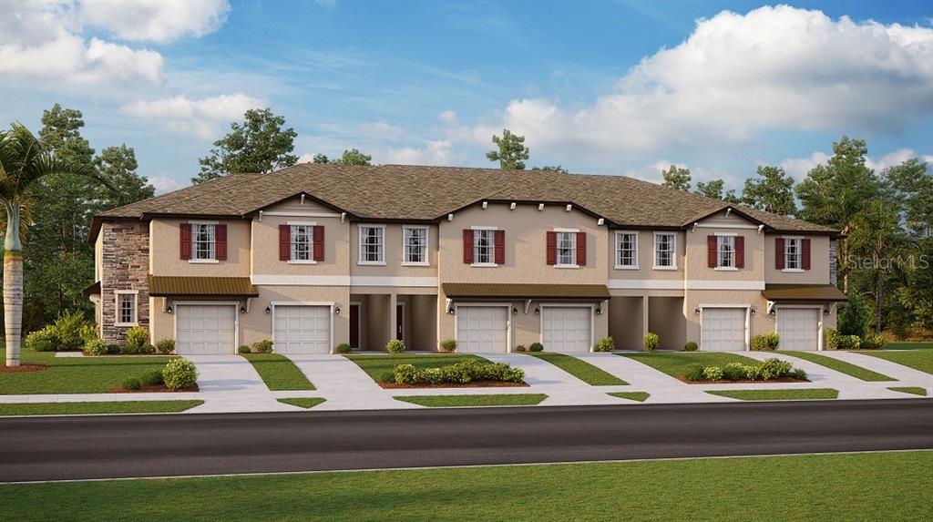 a view of multiple houses with a yard