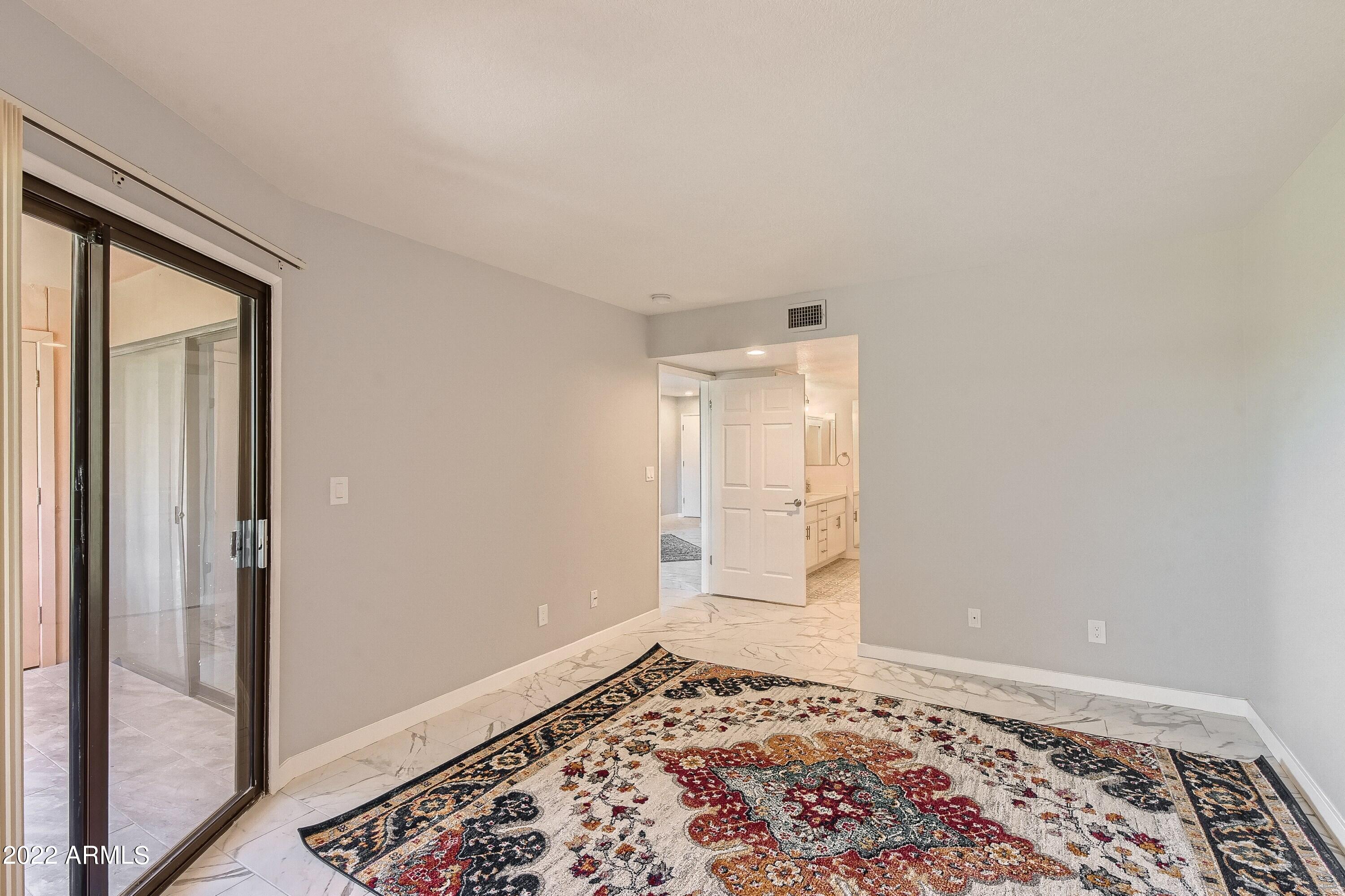 4303 East Cactus Road, Unit 326 Phoenix, AZ 85032 - Photo 7 of 17 14 Primary Bedroom