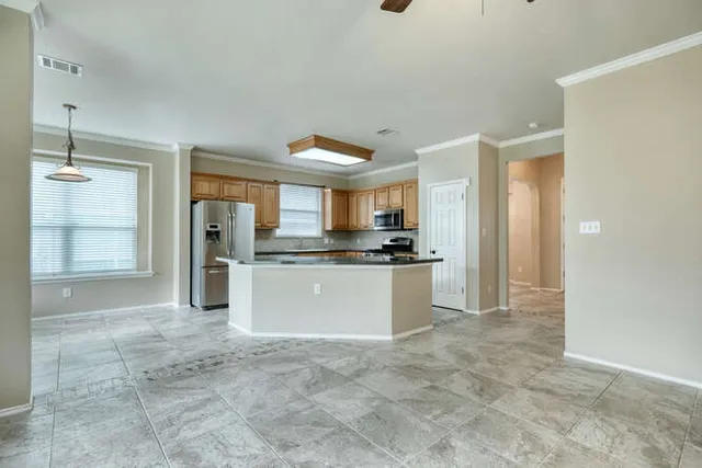 a view of an empty room and window