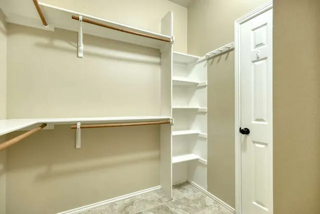 a bathroom with a tub sink shower and mirror