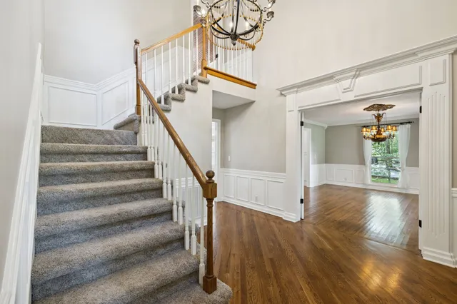 a view of a living room with furniture and wooden floor
