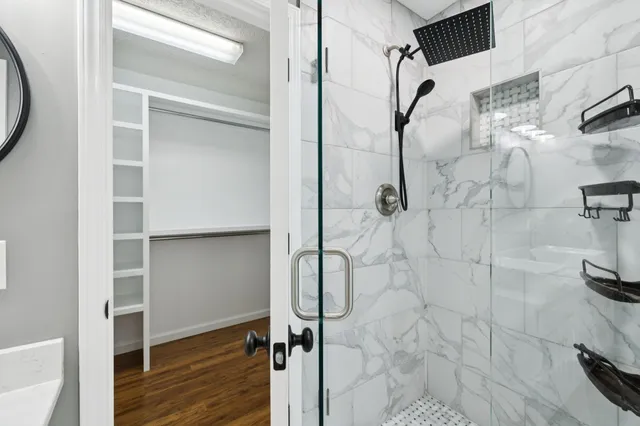 an empty room with fireplace and windows