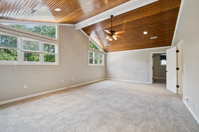 a front view of a house with swimming pool having outdoor seating