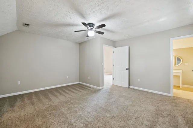 a view of a terrace with chairs and a fire pit
