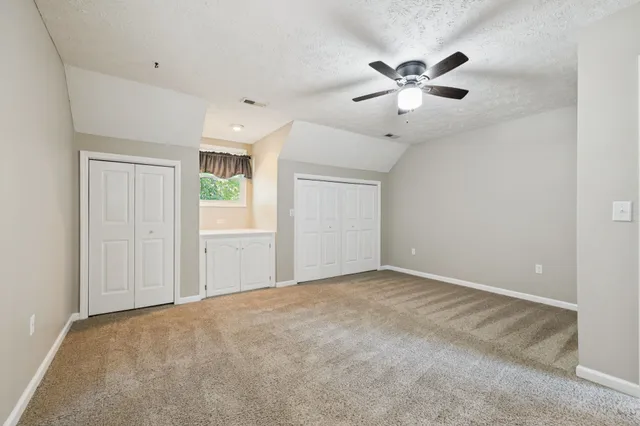 a view of a patio with dining table and chairs with a fire pit