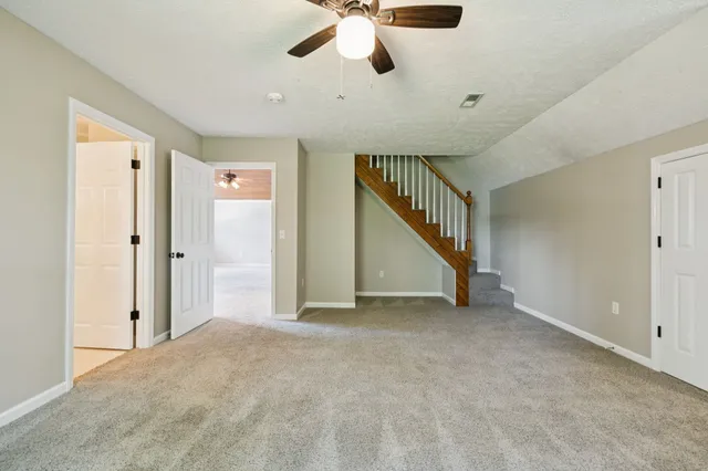 a view of a backyard with large trees